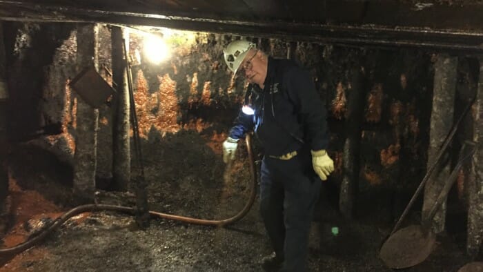 Retired miners give the tours at The Miners Museum. You can see that the ceilings are low, the walls and ceiling are damp and it's very dark.