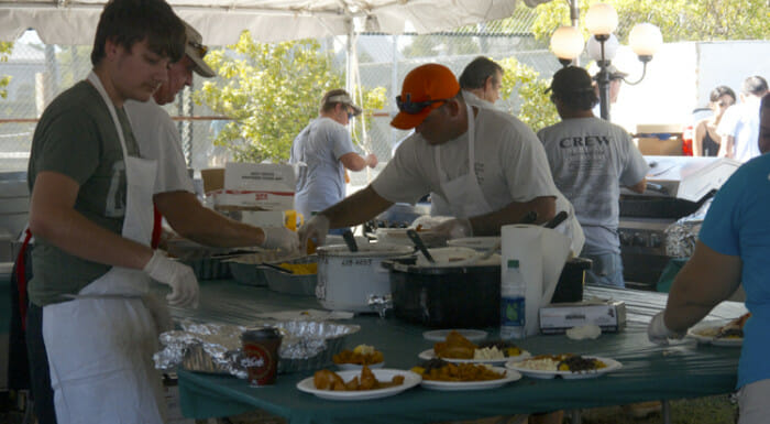 Volunteers dishing up the seafood sampler.